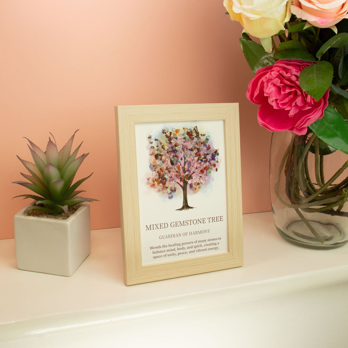 Tree of Life Crystal Art Picture featuring a mixed gemstone tree in a simple frame, surrounded by plants, for home decor.